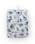 Flannel blanket with animal pattern on a hanger against a white background