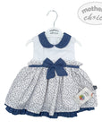 Baby dress with blue collar and bow on a hanger, branded 'Mother's Choice'.