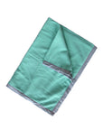 Teal blanket with gray border on a white background