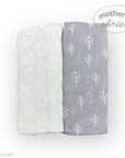 Two baby blankets, one white and one gray with tree pattern, on a white background.