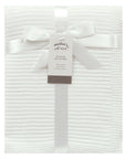 White textured blanket with a ribbon and 'Mother's Choice' tag on a white background
