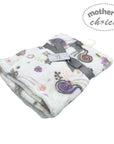 Floral patterned blanket with 'Mother's Choice' label on a white background