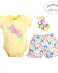 Baby outfit set with yellow onesie, floral shorts, and headband on a white background.