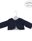 Navy blue baby bolero on a hanger with 'mother's choice' label on a white background