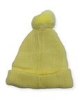 Yellow knit beanie with a pom-pom on a white background