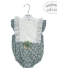 Baby romper with lace details on a hanger, branded 'mother's choice'.