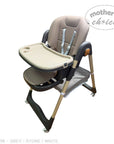 High chair with tray on a white background, featuring 'Mother's Choice' branding.