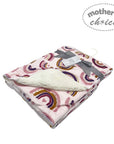 Baby blanket with rainbow pattern and white fur on a white background, branded 'Mother's Choice'.