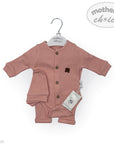 Baby romper with buttons on a hanger against a white background, featuring 'mother's choice' branding.