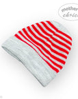 Knitted beanie with red and gray stripes on a white background, featuring 'mother's choice' branding.