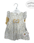 Baby dress with floral pattern and bow tie on a hanger, branded 'Mother's Choice'.