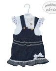 Children's denim pinafore dress with white top on a hanger, branded 'Mother's Choice'.