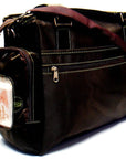 Brown leather handbag with a visible brand label on a white background