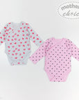 Two baby bodysuits with heart patterns on a white background, branded 'Mother's Choice'.