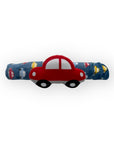 Red car-shaped toy on a blue background with vehicle illustrations