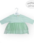 Light green dress on a hanger with 'Mother's Choice' branding on a white background