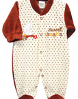 Baby onesie with polka dot pattern and 'sweet dreams' text on a white background