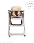 Beige and white high chair with 'Mother's Choice' branding on a white background