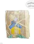 Folded baby blanket with cartoon design and 'Mother's Choice' label on a white background