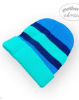 Blue and green striped baby hat on a white background with 'mother's choice' branding.
