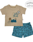 Children's outfit with beige shirt and blue shorts featuring a bear design on a white background.