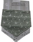 Reversible bandana bib with celestial pattern packaging on a white background