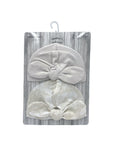Gray baby turban with bow in packaging on a white background