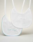 White bib with 'Little Angel' embroidery on a light background
