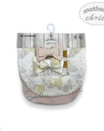 Baby diaper with bow and floral pattern on a 'Mother's Choice' branded package.