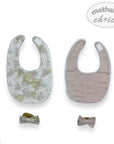 Two baby bibs with floral and solid designs, accompanied by two bow ties, on a white background with 'mother's choice' branding.