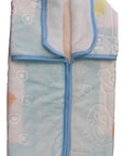 Folded baby blanket with cartoon designs on a white background