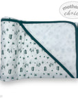 Baby blanket with green border and small patterns on a white background, branded 'Mother's Choice'.