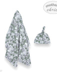 Baby blanket and hat set with green floral pattern on a white background, featuring 'mother's choice' branding.