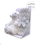White teddy bear and gray chevron blanket with a white bow in a box, branded 'Mother's Choice'.