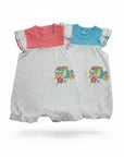 Two baby rompers with colorful designs on a white background