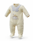 Baby onesie with embroidered design on a white background