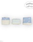 Three baby blankets with blue and white patterns on a white background, featuring 'Mother's Choice' branding.