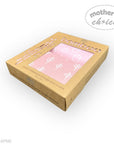 Box of bamboo change pad covers with pink design on a white background