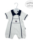 White baby romper with navy trim on a hanger, featuring 'mother's choice' branding.