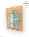Packaged bamboo muslin wraps with a visible brand logo on a white background