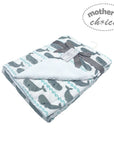 Baby blanket with whale pattern and 'mother's choice' label on a white background