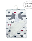 Baby blanket with bow tie and mustache pattern on a white background, branded 'Mother's Choice'.