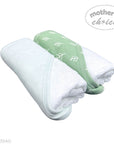 Two folded towels, one white and one green with white patterns, on a white background with 'Mother's Choice' branding.