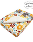 Floral-patterned baby blanket with a gray ribbon and 'mother's choice' label on a white background