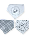 Three baby bibs with different patterns on a white background