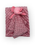 Pink textured blanket with a pink elephant plush toy on a white background