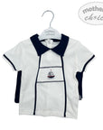 White and navy children's shirt with a sailboat design on a hanger, branded 'Mother's Choice'.