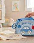 Stork And Baby blue round day pack with car embroidery and button details. Features "cute as a button" text.