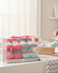 Stork And Baby 4 pack baby socks gift pack with doughnut theme in pink, mint, and grey. Soft cotton blend.