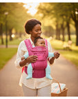 Stork And Baby Mothers Choice 3 Way Elegant Baby Carrier in pink, featuring a woman carrying a baby outdoors.